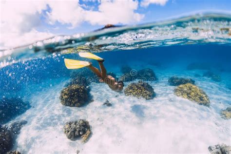 Woman Swimming Underwater In Transparent Blue Ocean At Mauritius Le