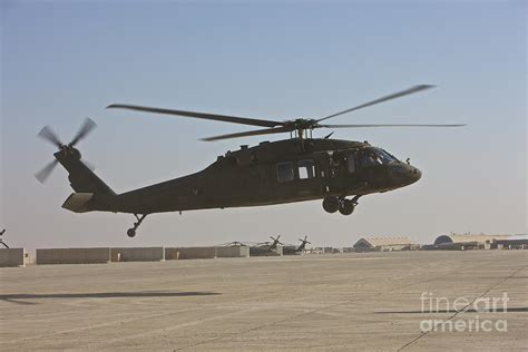 A Uh 60 Black Hawk Landing Photograph By Terry Moore Fine Art America