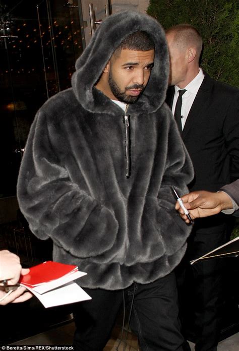 Drake Keeps A Low Profile In Faux Fur Coat As He Leaves Rihannas