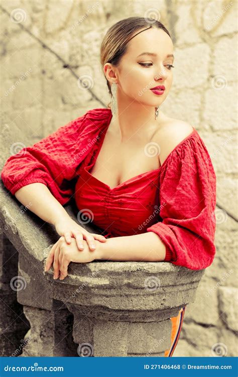Gorgeous Portrait Of A Beautiful Woman In The Old City On The Stairs