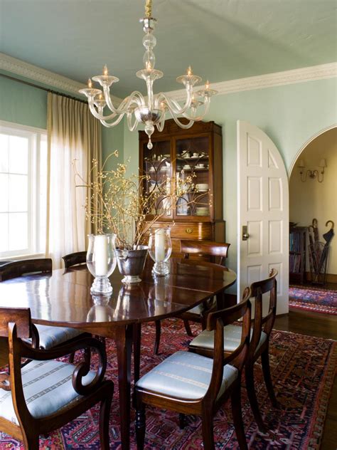 Requires eight candelabra base bulbs, not included. Transitional Dining Room With Arched Door and Glass ...