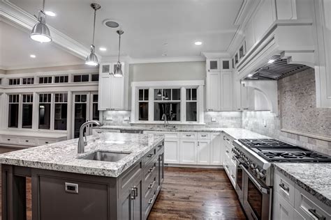 It is by coloring the cabinets with white paint but leaving the black countertops as they are. Kashmir white granite countertops Showcasing Striking ...