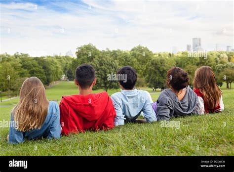 Teenagers Hanging Out In A Park Stock Photo Alamy