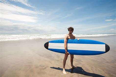 Strong Young Surf Man Portrait At The Beach With A Surfboard Ba Stock