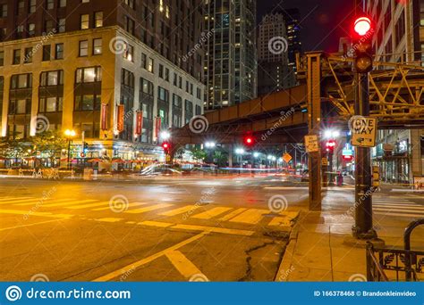 Night Time Long Exposure Of Busy Downtown Chicago Intersection Stock