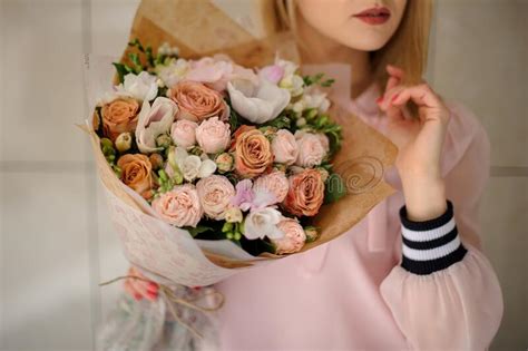 Woman Holding Blossoming Bouquet In Pastel Colors In Her Hands Stock