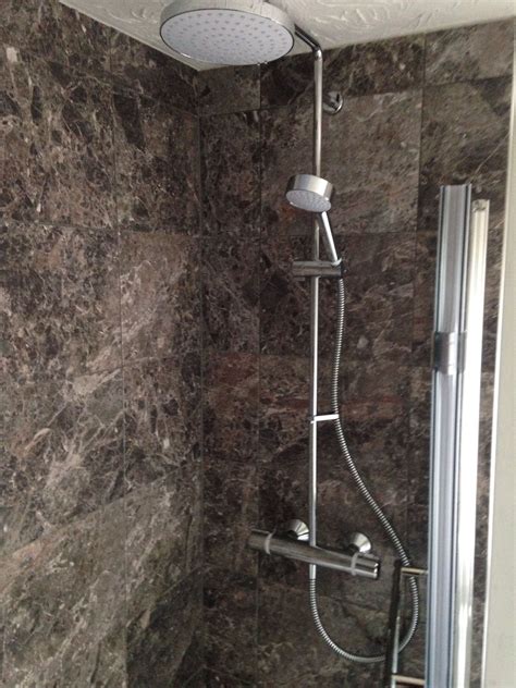 It is rated for damp environment. Shower | Track lighting, Ceiling lights, Shower