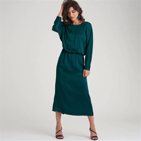 loose fitting dresses with elastic waist and grown on sleeves options include cross over back