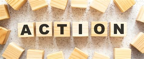 Premium Photo The Word Action Consists Of Wooden Cubes With Letters