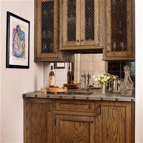 I love the reflectiveness and interest antique mirror. Wet Bar With Mirrored Backsplash Design Ideas