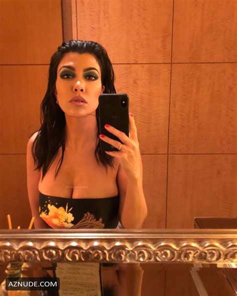 kourtney kardashian sexy shows off her deep cleavage and round butt in various photoshoots aznude