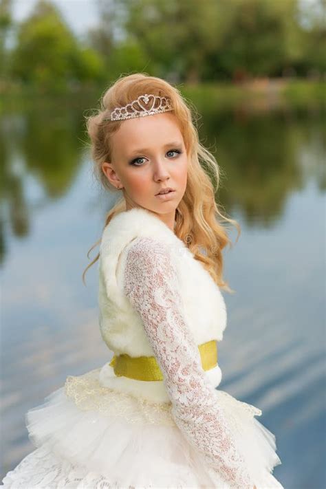 Fashion Photo Of A Young Girl In A Beautiful White Dress Stock Image