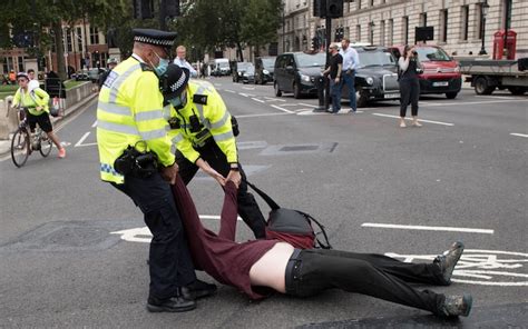 police ask extinction rebellion protesters to stop going floppy when they are arrested