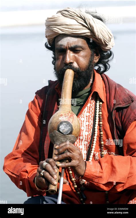 A Snake Charmer With His Musical Instrument At Varanasi Or Banaras