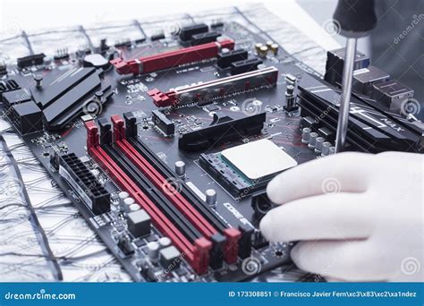 Hands Of A Technician Assembling Computer Hardware Parts New Cpu Is