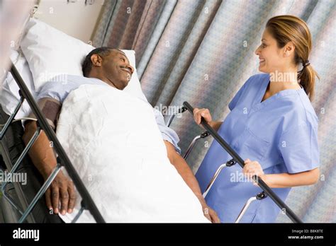 Nurse Caring For Patient Stock Photo Alamy
