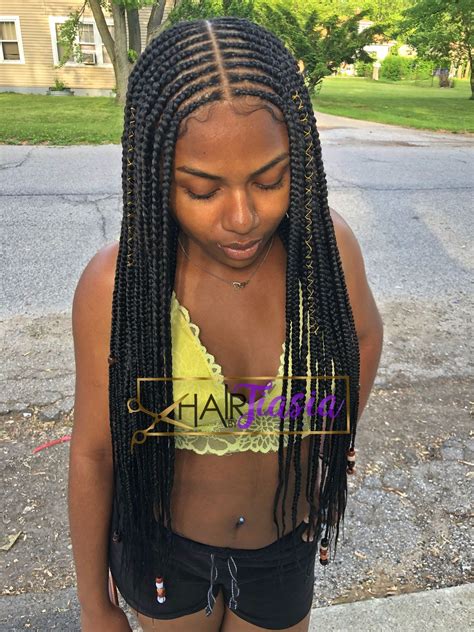 Braided hairstyles for black women are very creative and versatile. #hairbytiasia #tribalbraids #layeredbraids #boxbraids # ...