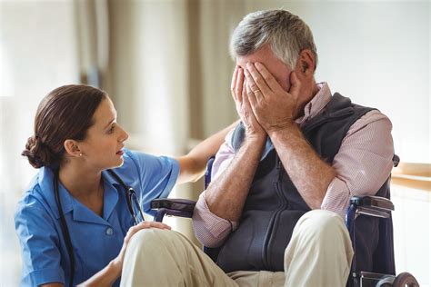 Nurse Taking Care Of Sad Senior Man In A Retirement Home Cna Classes