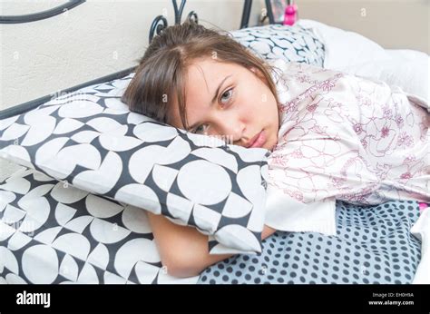 Cute Young Girl Waking Up In Bed Stock Photo Alamy
