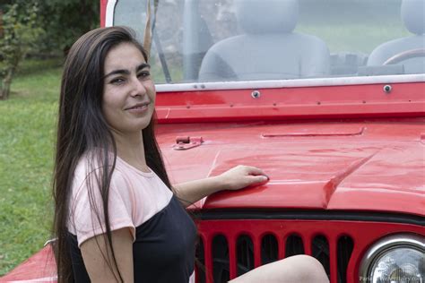 Paris Poses Naked Outdoors By Her Red Jeep