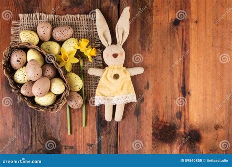 Easter Background With Vintage Easter Bunny Decoration Over Old Wood