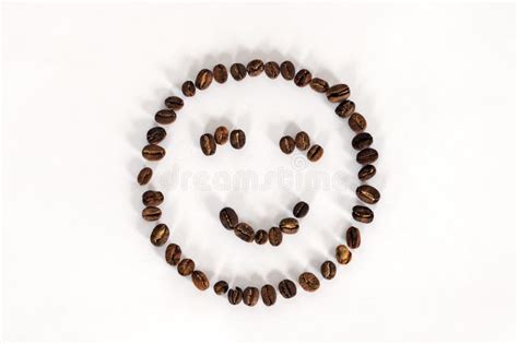 Artificial Smiling Face Made From Coffee Beans On White Background