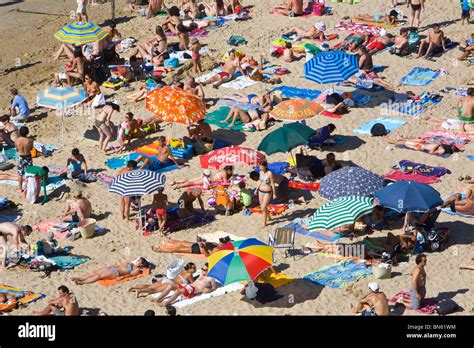 Beach Scene Sunbathers Colorful Umbrellas Hi Res Stock Photography And