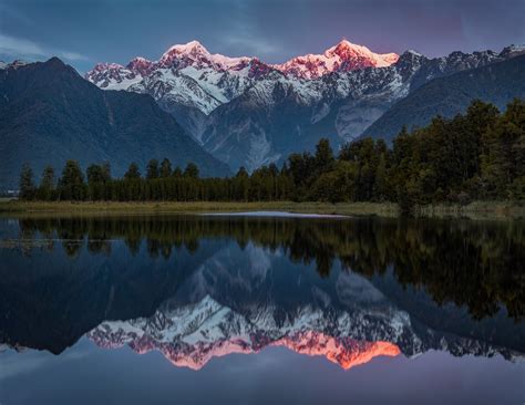 Lake Matheson New Zealand The Last Light Of The Day Hits The Summits