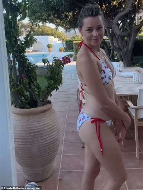 Elizabeth Banks Slips Into A Fun Cherry Print Bikini As She Arrives In Greece For Summer Getaway