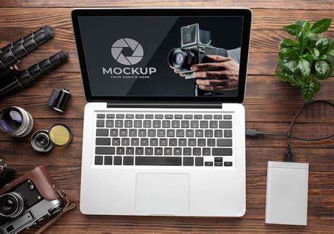 Premium Psd Top View Of Photographer Wooden Workspace With Laptop