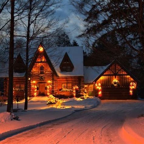 A Log Cabin Laced With Glowing Christmas Lights Tucked In A Winter