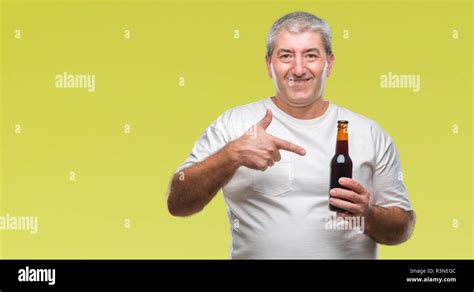 Handsome Senior Man Drinking Beer Bottle Over Isolated Background Very Happy Pointing With Hand