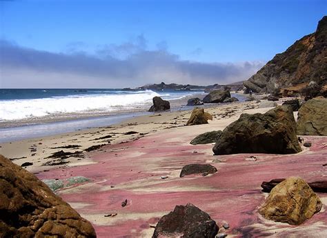 This is a purple sand beach in california with a small waterfall. 10 Colorful Beaches around the world | Top 10s