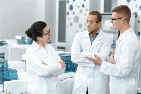 Diverse Group Of Professional Scientists Talking At The Lab Stock Photo