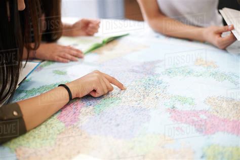 College Students Studying World Map In Classroom Stock Photo Dissolve