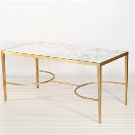 Polished gold legs combine to create a beautiful aesthetic that will elevate any decor. Chase Gold Leaf Mirrored Coffee Table