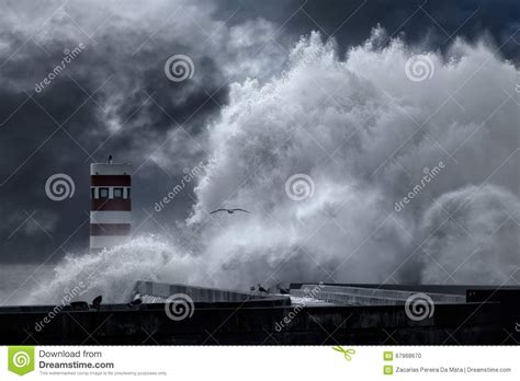 Stormy Sea Waves Over Pier And Lighthouse Stock Photo Image Of Ocean
