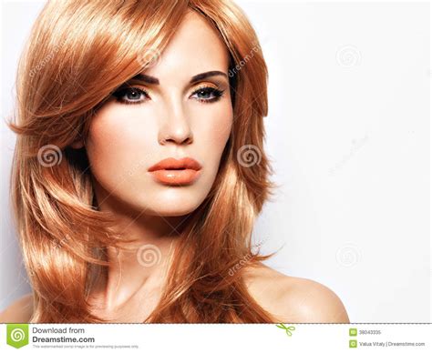 Portrait Of A Beautiful Woman With Long Straight Red Hair