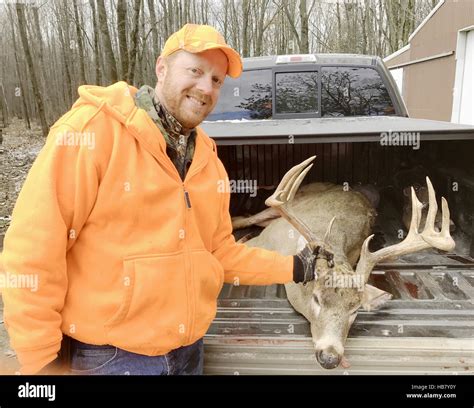 Deer Hunter In Blaze Orange With An Eleven Point Buck Stock Photo Alamy