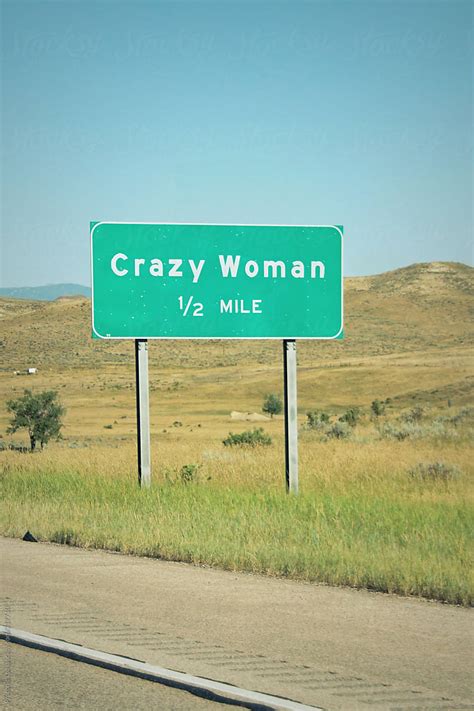 Crazy Woman In 12 Mile Road Sign Stocksy United