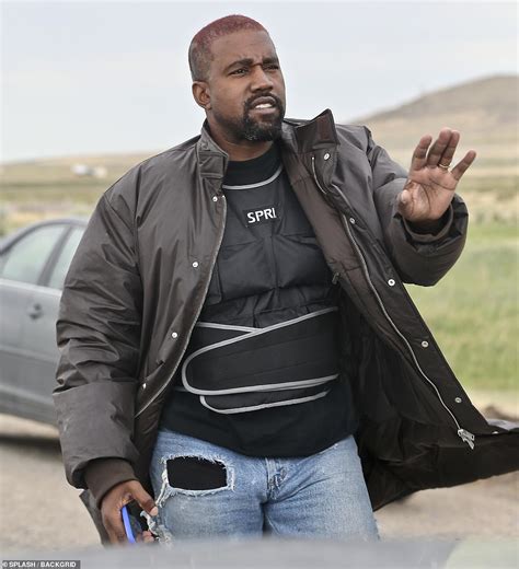 Kanye West Looks Distracted As He Leaves Wyoming Compound In A Weighted