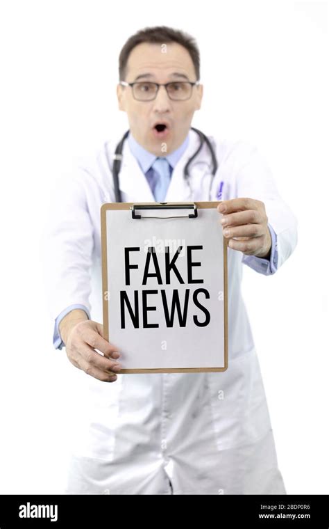Shocked Doctor Holds Clipboard With Text Fake News Mortality Medical