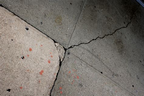Cement Sidewalk With Cracks And Paint Splatters Picture Free