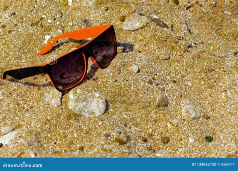 Sunglasses Are Lost And Lie On The Beach By The Sea Black With Stock