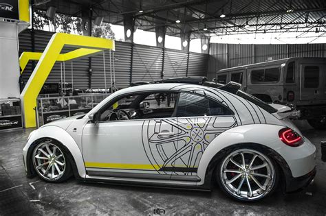 Customized To Impress White Volkswagen Beetle Dressed In Aftermarket
