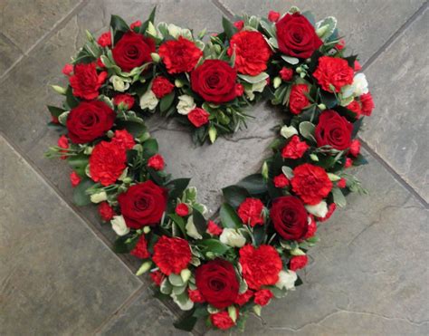 Loose Style Open Heart Of Red Flowers Including Roses And Carnations