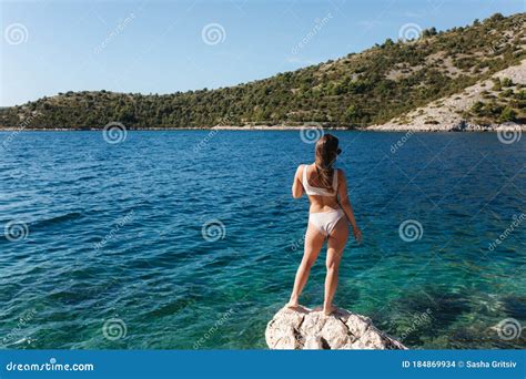 Woman In Bikini Stand On The Rock By The Sea Beautiful Lagoon Woman