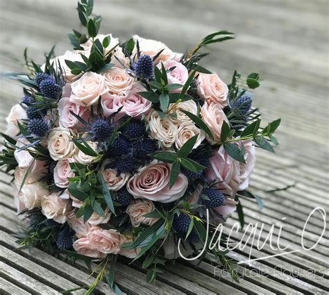 Sweet Avalanche Roses Thistle And Eucalyptus Bridal Bouquet Vow