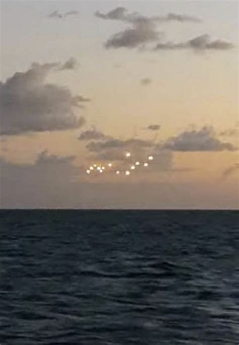 mysterious fleet of glowing ufos seen floating in middle of ocean mirror online