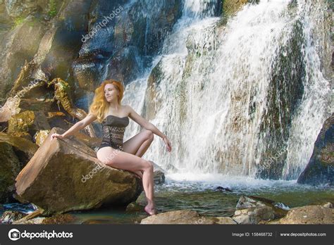 Beautiful Girl Posing In A High Waterfall Absolutely